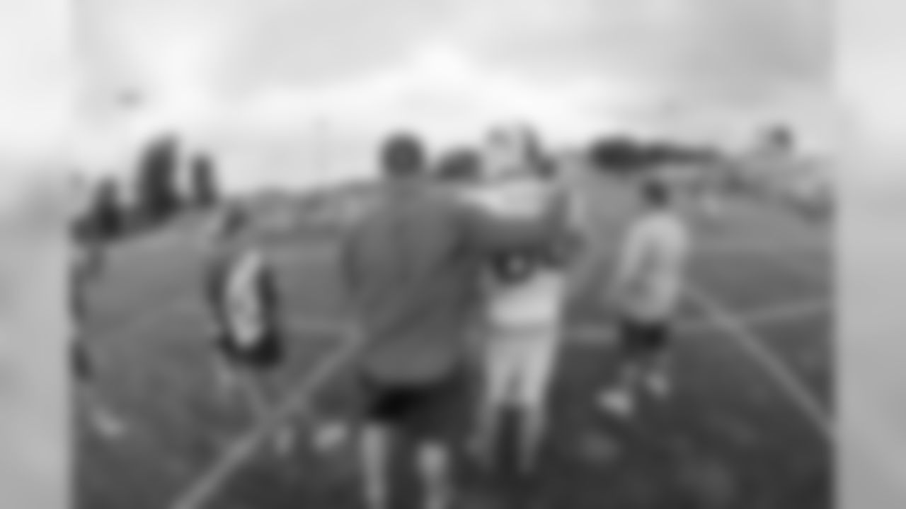 Head coach Rex Ryan gives a word of encouragement to tight end Nick O'leary (84) on the sidelines.