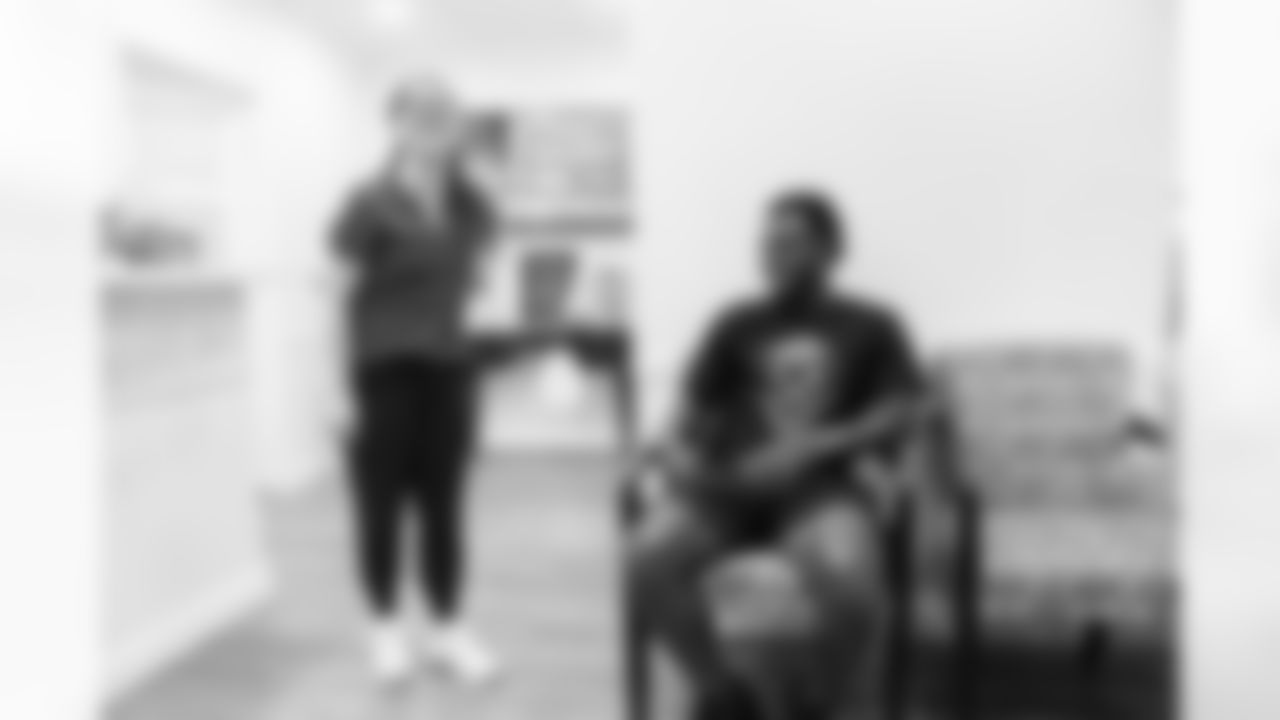 Isaiah McKenzie speaks with employees at PROSPINE Chiropractic & Health, a neighbor of his restaurant La Traila Barbecue during the 2022 off-season in Miami, Florida. Photo by Ben Green