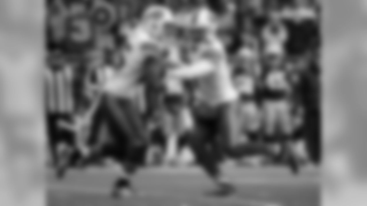 QB Tyrod Taylor (No. 5) hands the ball off to RB LeSean McCoy (No. 25)