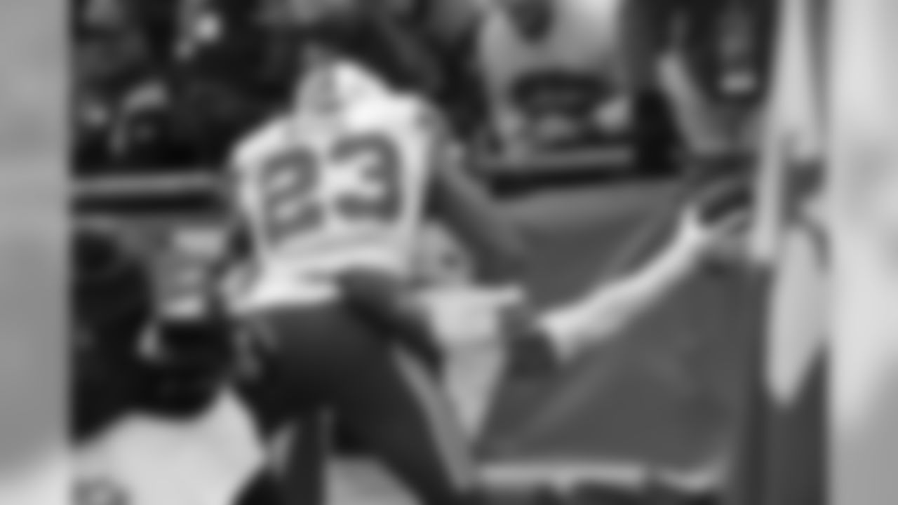 S Micah Hyde (No. 23) celebrates with S Jordan Poyer (No. 21) after pick-six