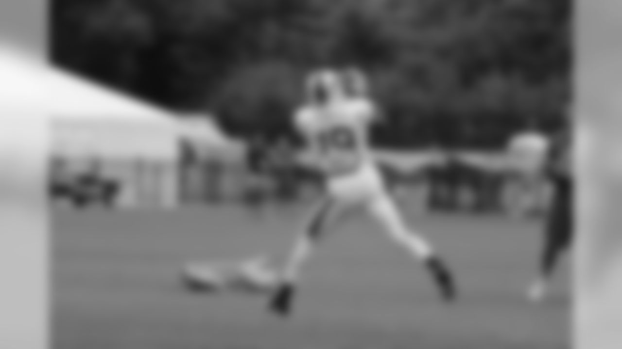 Wide receiver Walter Powell (19) catches a ball on the field.