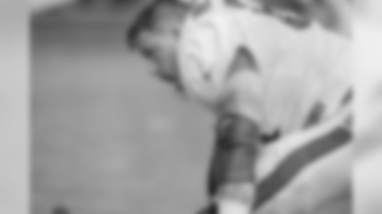 Guard Richie Incognitio (64) stretches during practice.