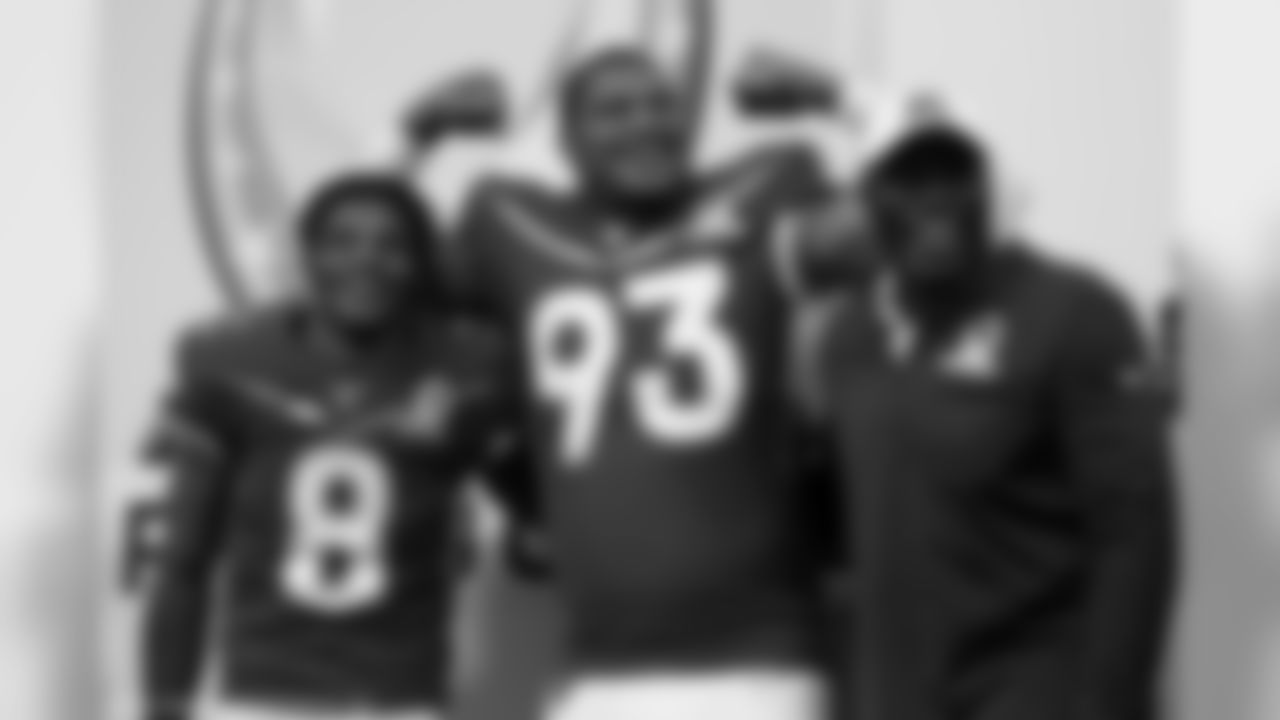Jacksonville Jaguars defensive end Calais Campbell (93) and Baltimore Ravens quarterback Lamar Jackson (8) celebrate with Legends Captain Bruce Smith after the 2020 NFL Pro Bowl football game, Sunday, Jan. 26, 2020 in Orlando, Fla. (Logan Bowles/NFL)
