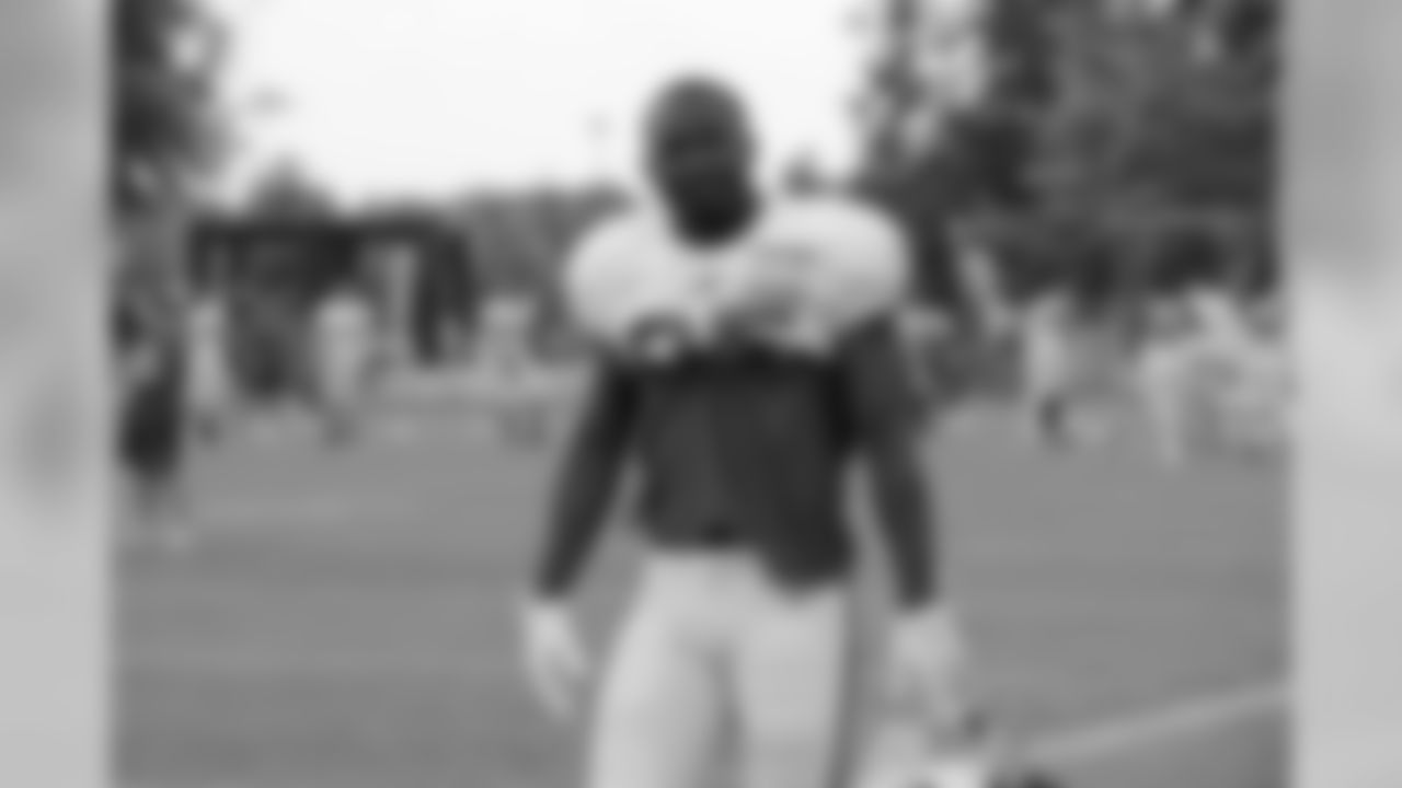 Running back LeSean McCoy (25) smirks on the field.
