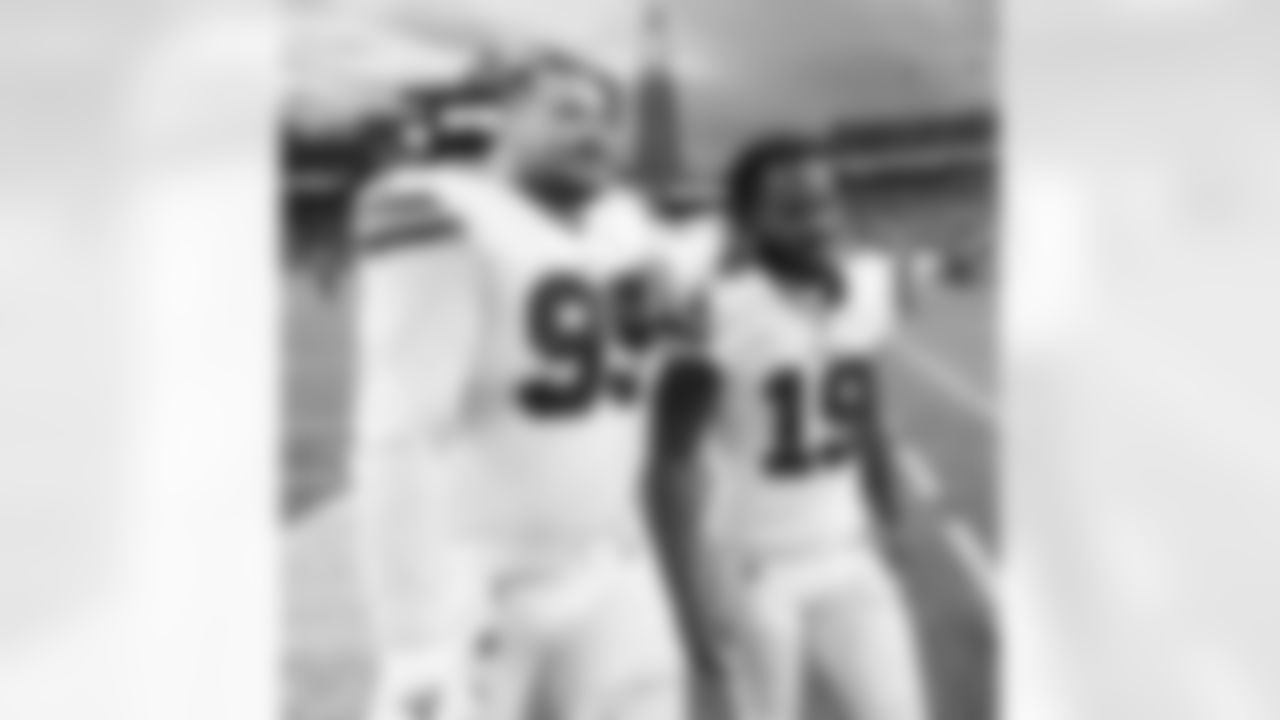 Harrison Phillips (99) and Isaiah McKenzie (19). Buffalo Bills vs New England Patriots at Gillette Stadium, December 26, 2021. Photo by Bill Wippert