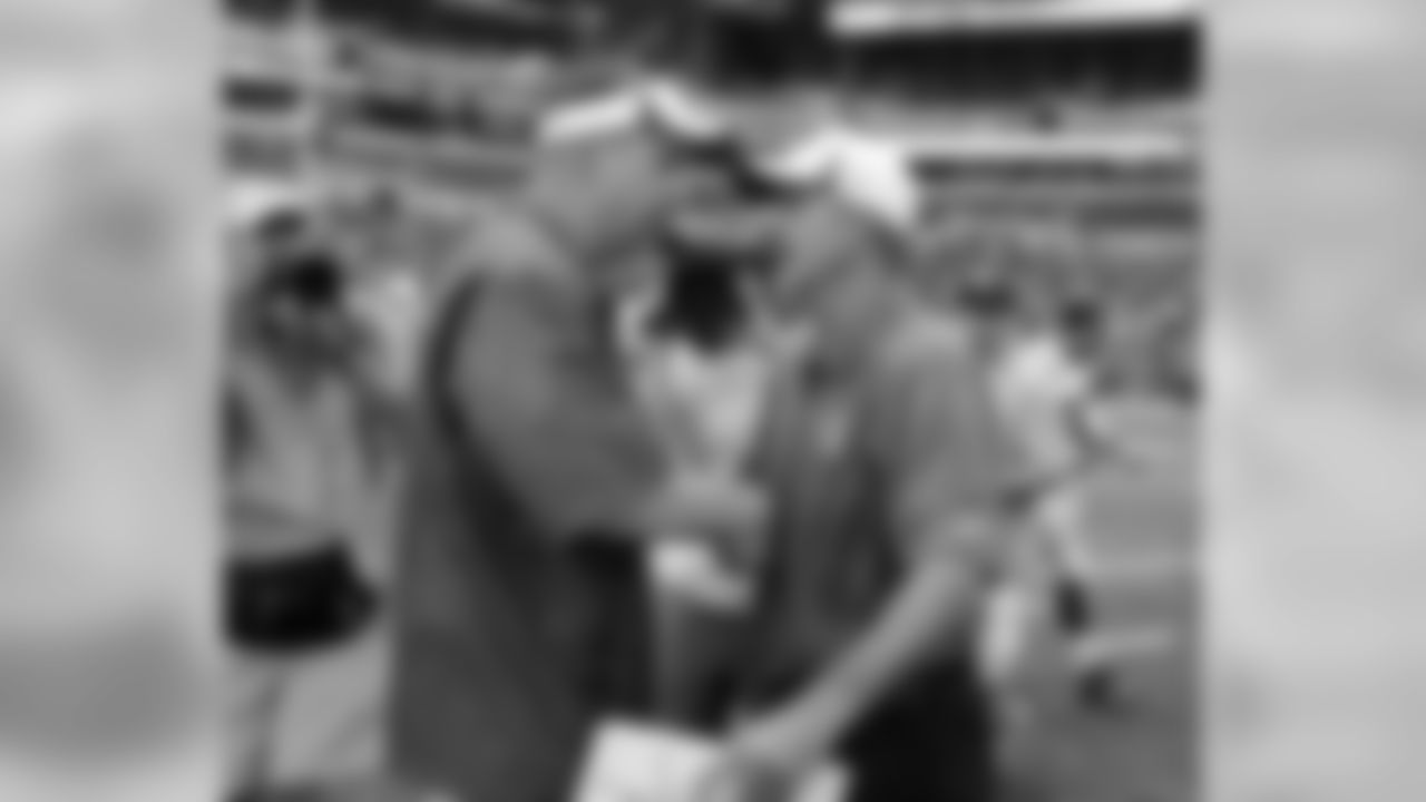 Buffalo Bills head coach Doug Marrone, right, talks with Indianapolis Colts head coach Chuck Pagano following an NFL preseason football game on Sunday, Aug. 11, 2013, in Indianapolis. Buffalo defeated Indianapolis 44-20. (AP Photo/Michael Conroy)