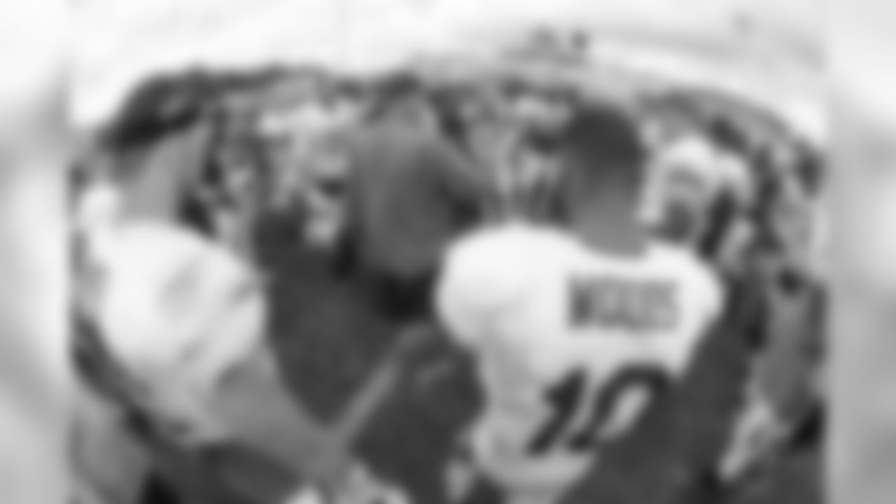 Head coach Rex Ryan leads a huddle at the end of practice.
