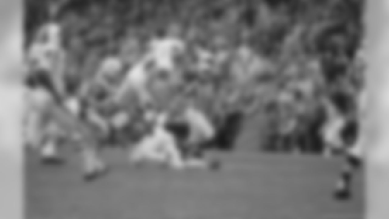 October 20, 1968 | Richard Trapp (28), Buffalo Bills end leaps after taking pass from Don Darragh and picking up first down in second period of their game with Boston Patriots in Boston. Patriots bringing him down are John Williamson (left), and John Charles.