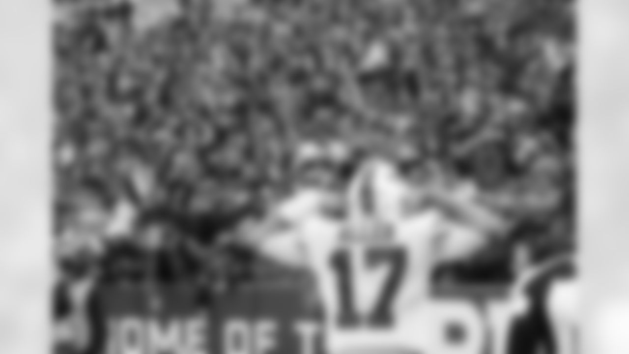 Josh Allen (17) celebrates his touchdown with fans. Buffalo Bills vs Miami Dolphins at Highmark Stadium, October 31, 2021. Photo by Bill Wippert
