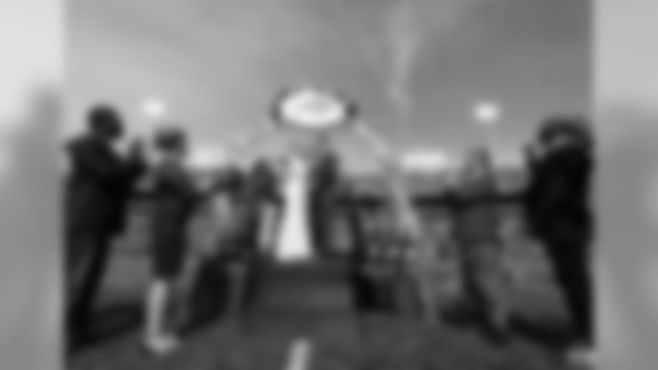 The Buffalo Bills celebrate the marriage of Mackenzie Park and Jordan Binggeli, the winning couple from the ÒHalftime Wedding Experience of a LifetimeÓ contest, at New Era Field on September 29, 2019.