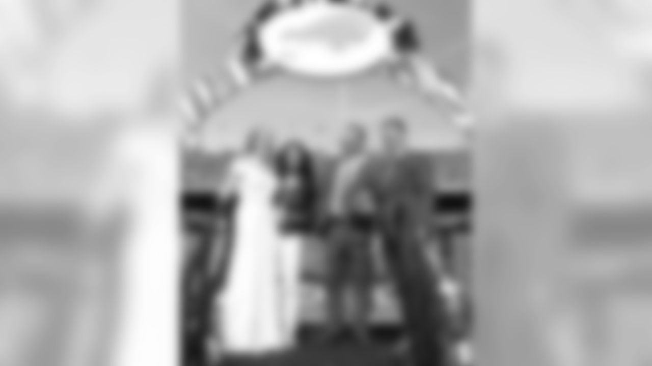 The Buffalo Bills celebrate the marriage of Mackenzie Park and Jordan Binggeli, the winning couple from the ÒHalftime Wedding Experience of a LifetimeÓ contest, at New Era Field on September 29, 2019.