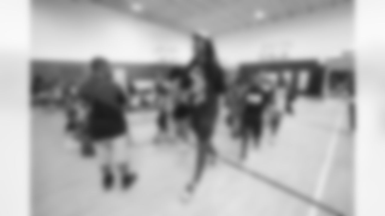 Tremaine Edmunds hands out shoes and school supplies at the Boys and Girls Club of Buffalo, Masten Club House, on August 15, 2022. Photo by Ben Green