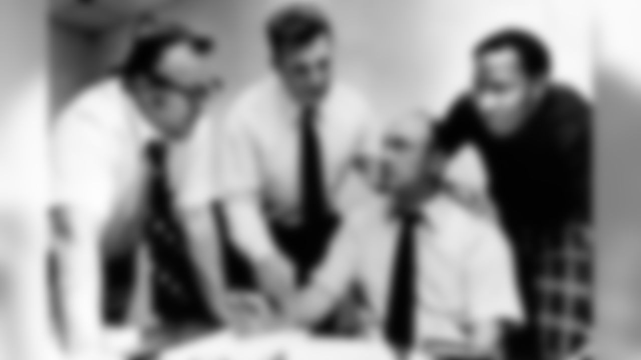 From left are: Bills' chief scout Bob Celeri; Saban; personnel director Harvey Johnson and scout Elbert Dubenion.