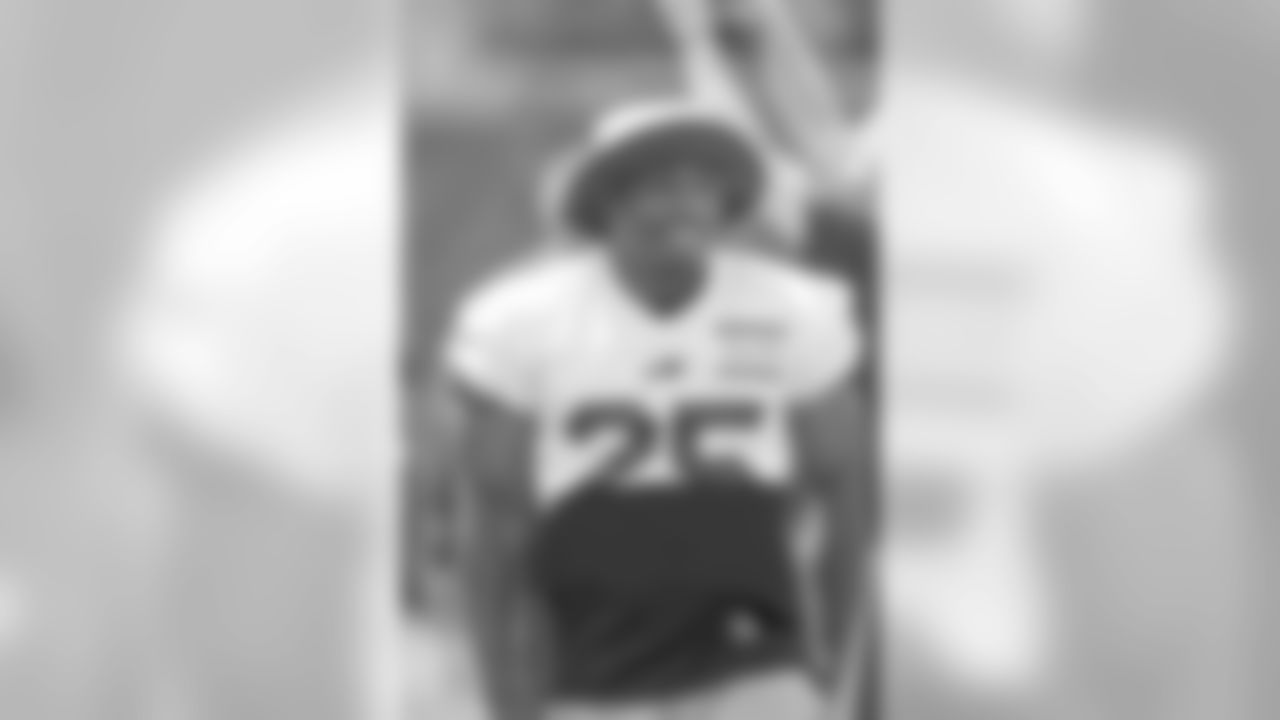 Running back LeSean McCoy (25) smiles for the camera at minicamp.