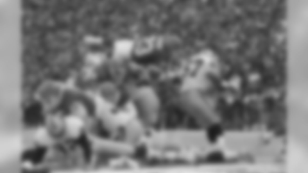 Buffalo Bills' running back Kenneth Davis (23) dives over the top for a Second quarter touch down against the Los Angeles Raiders during, NFL playoff game, Saturday, Jan. 15, 1994 in Orchard Park, N.Y. (AP Photo/Bill Sikes)