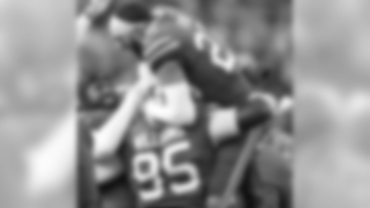 Buffalo Bills defensive tackle Kyle Williams (95) is smothered by Buffalo Bills strong safety Micah Hyde (23)] and Buffalo Bills defensive end Jerry Hughes (55)  after his 4th quarter catch and run at the Buffalo Bills vs Miami Dolphins game at New Era Field on December 30, 2018.     Photo by Craig Melvin