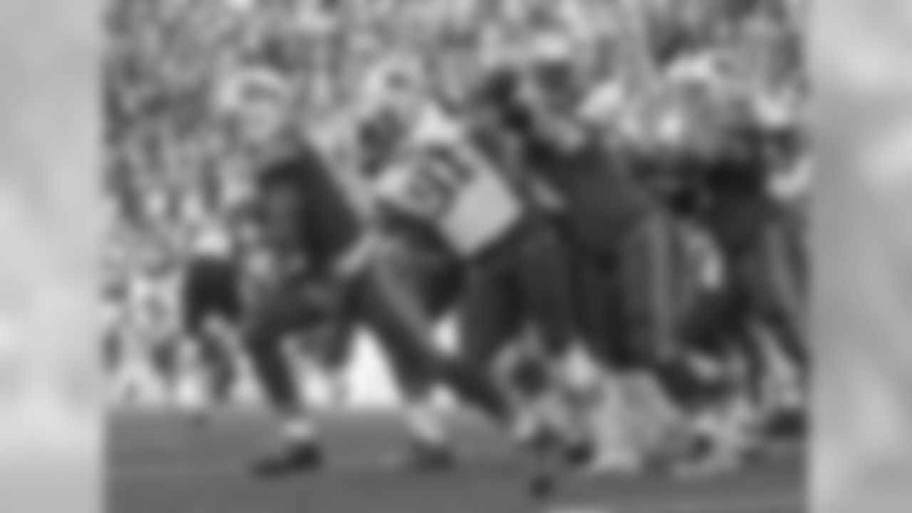 Tyrod Taylor #5, QB; Richie Incognito #64, G; and Eric Wood #70, C