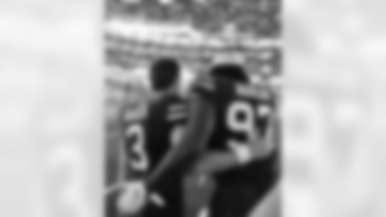 Matt Haack (3) and Mario Addison (97) pregame. Buffalo Bills vs New Orleans Saints at Caesars Superdome, November 25, 2021. Photo by Bill Wippert