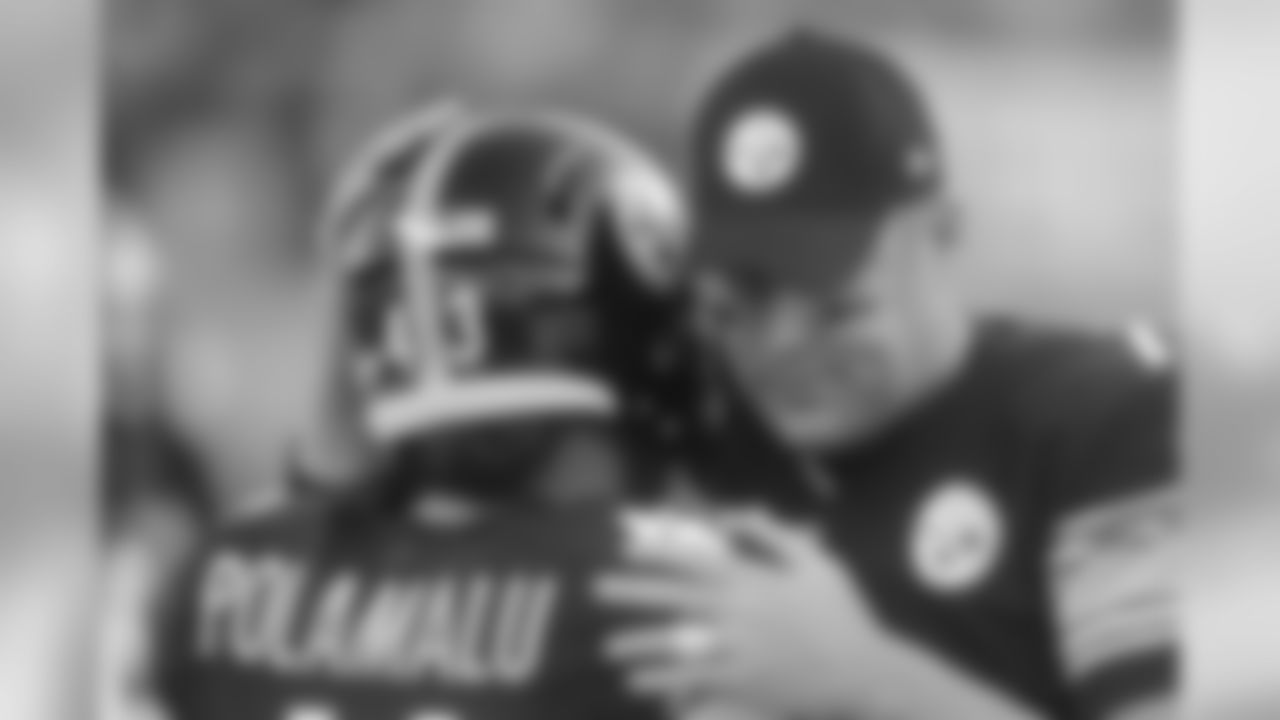 Pittsburgh Steelers quarterback Ben Roethlisberger, right, hugs teammate Troy Polamalu during warmups before an NFL football preseason game against the Buffalo Bills on Saturday, Aug. 16, 2014, in Pittsburgh. (AP Photo/Vincent Pugliese)