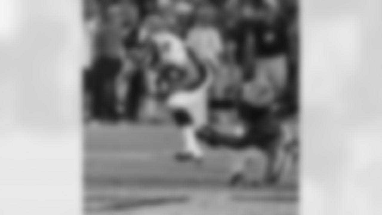 WR Brandon Stokley looks to shed a tackle near midfield.