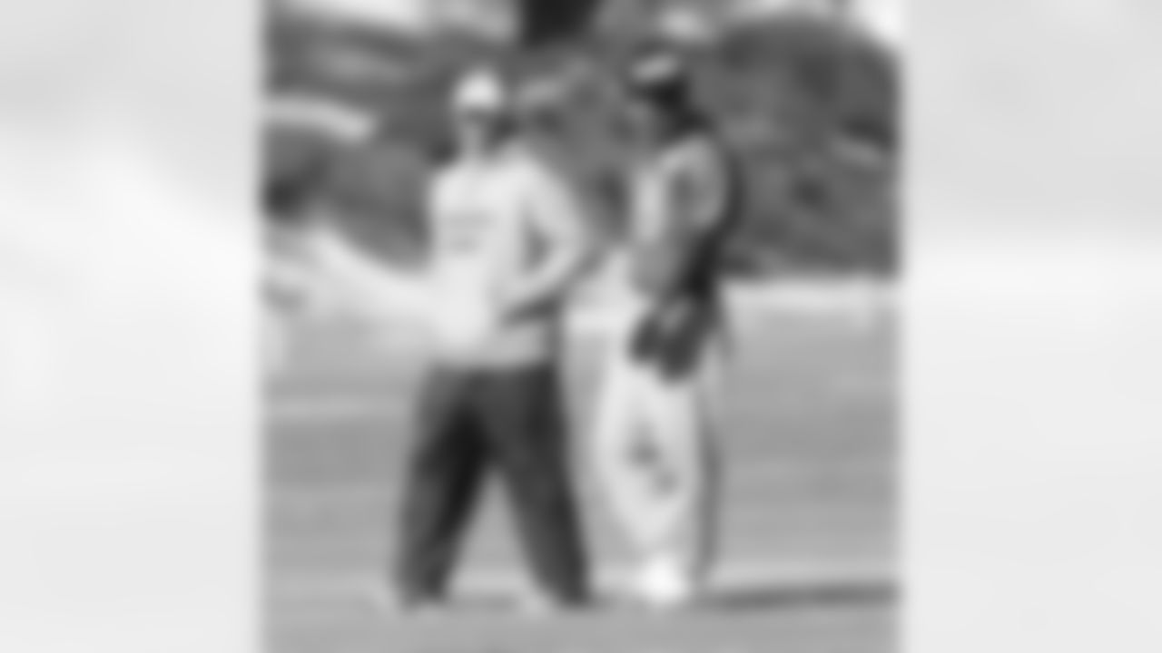 Offensive Coordinator Adam Gase and Peyton Manning