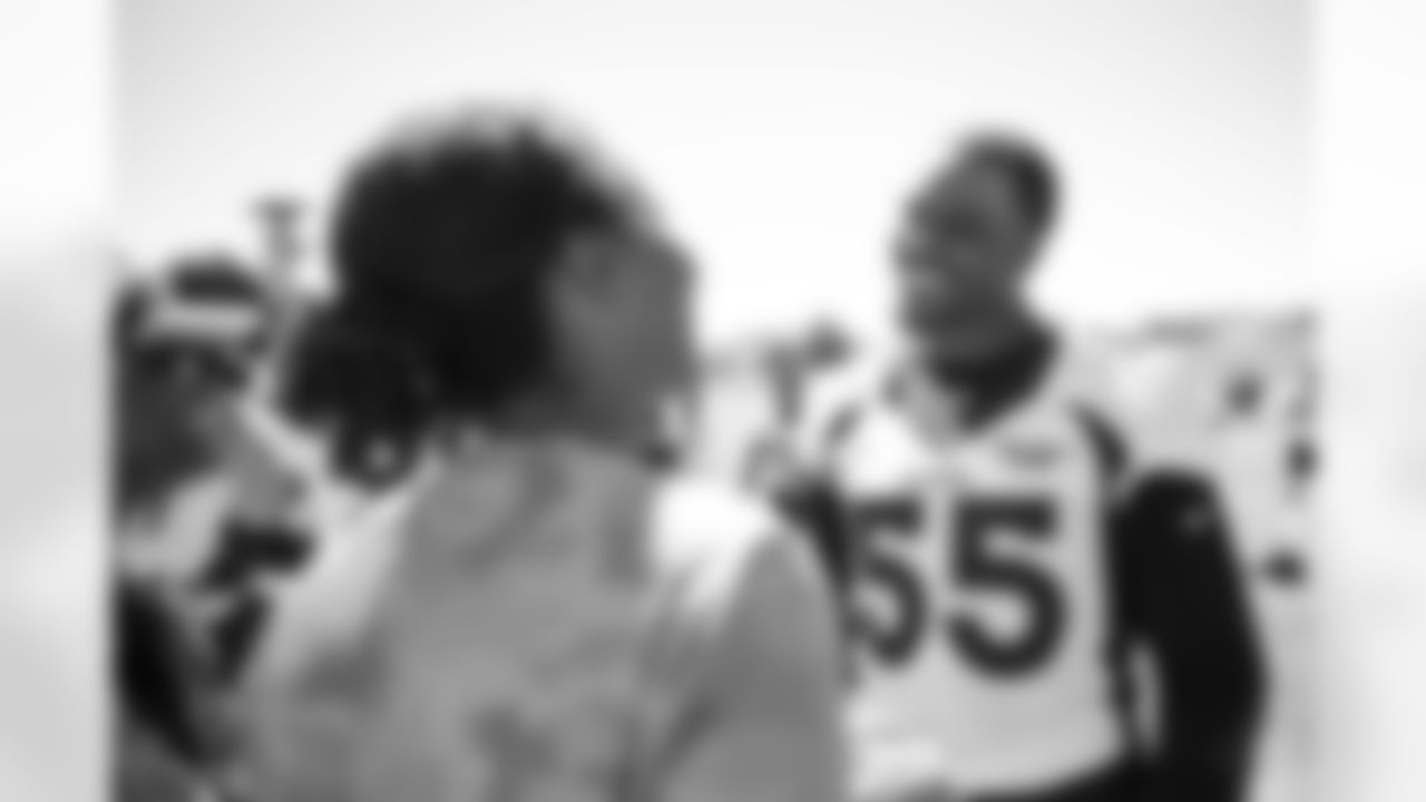 Frank Clark signs autographs for military members during USAA's Salute to Service NFL Boot Camp at Centura Health Training Center on August 29, 2023 in Englewood, Colorado. Photo by Ben Swanson / Denver Broncos