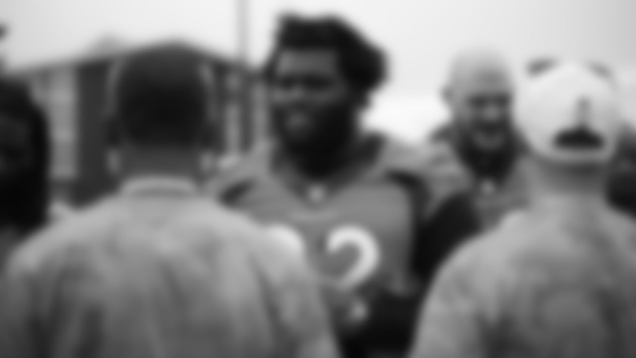 Zach Kerr signs autographs for military members from the USAA Salute to Service NFL Boot Camp after practice on August 21, 2019 at UCHealth Training Center.