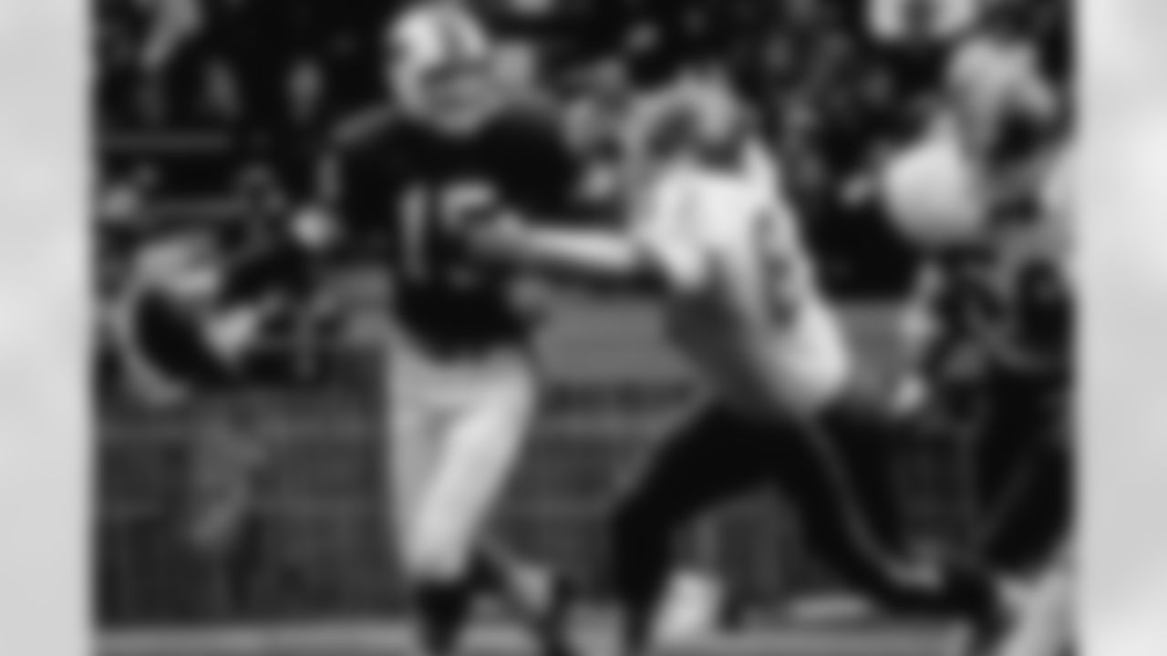Rich Jackson chases a Bills quarterback.