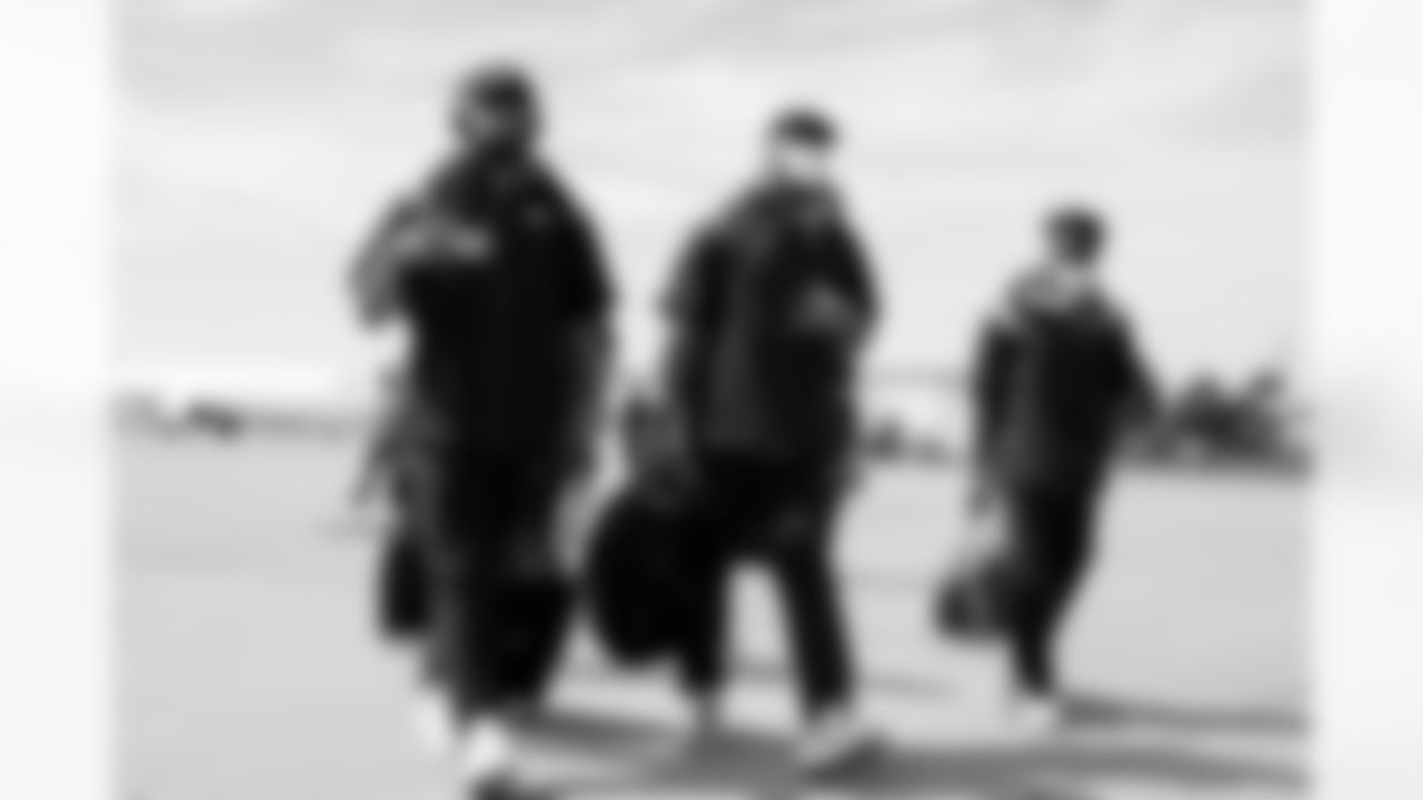 Curtis Robinson, Jonathon Cooper and Essang Bassey on the tarmac at Denver International Airport on September 11, 2021 during the team's travel to New York for a Week 1 game against the Giants. (Photo by Joe Abdellah)