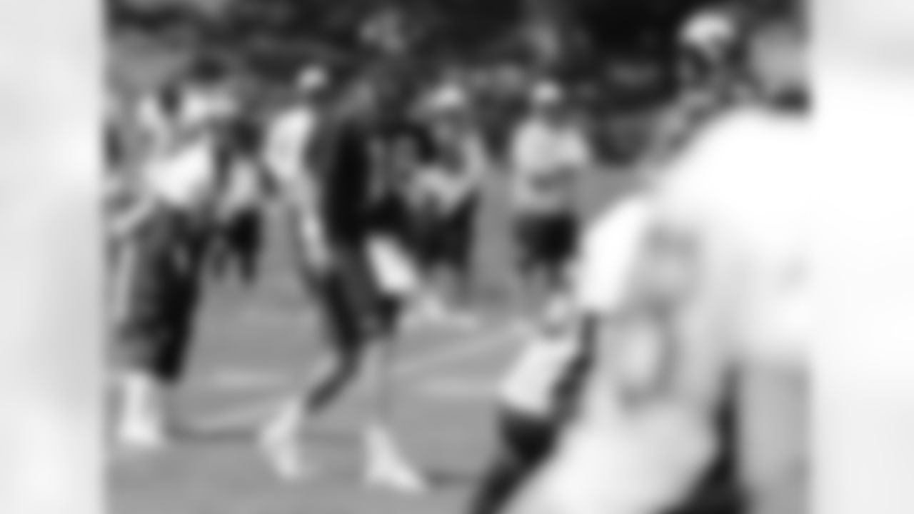 Manning makes a pre-snap signal.