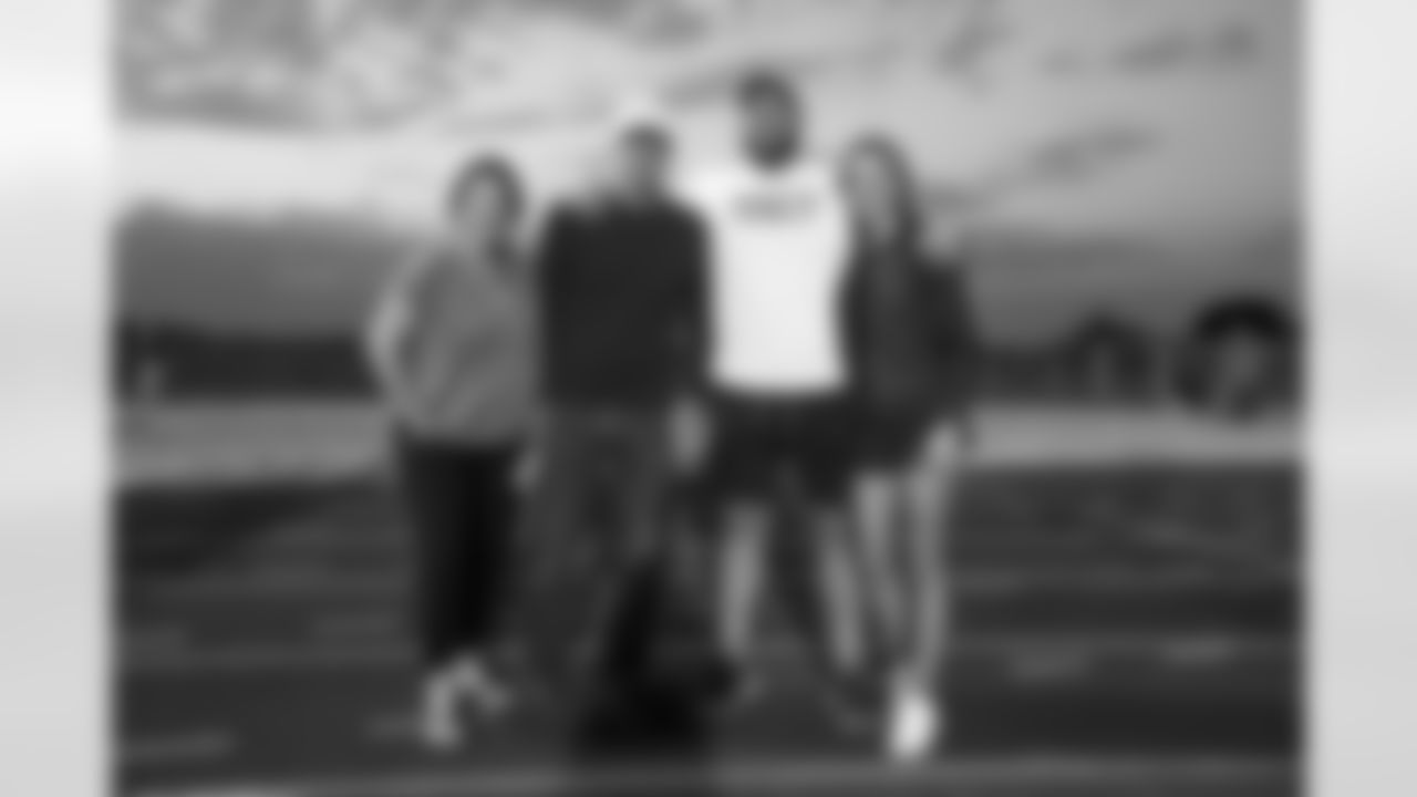 Ed Donatell, his wife, Dalton Risner and his fiancé at Dalton Risner's jersey retirement ceremony at Wiggins High School in Wiggins, CO on September 2, 2021.