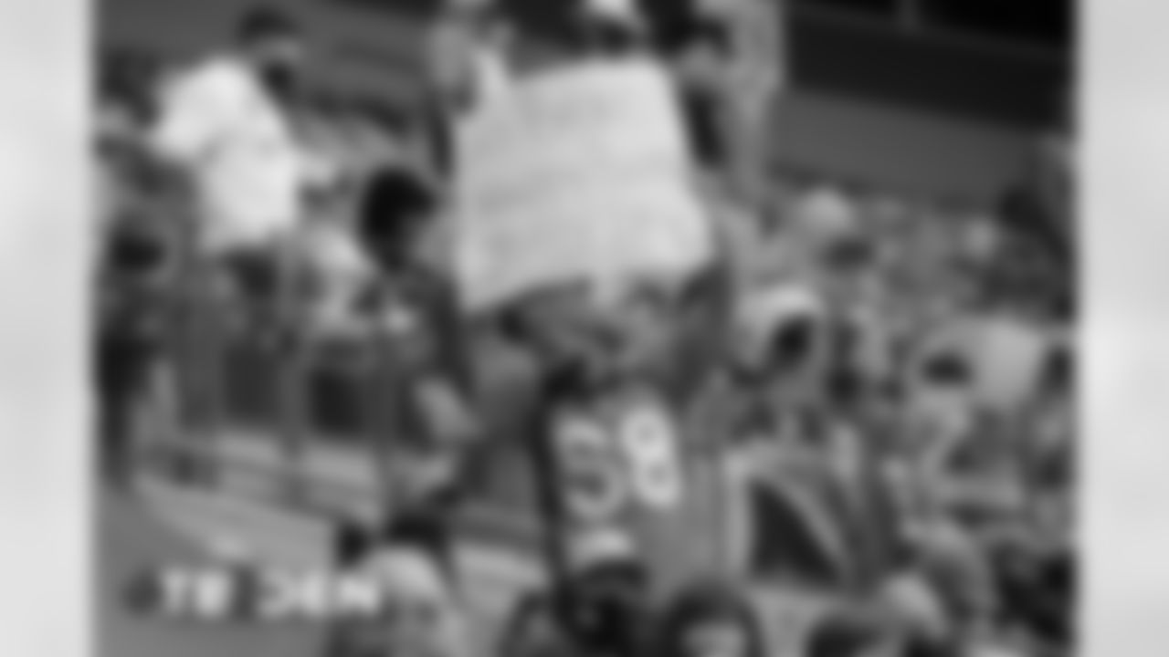 A Broncos fan holds up a sign during the second half of the Broncos' Week 3 game against the Tampa Bay Buccaneers at Empower Field at Mile High on September 27, 2020. (Photo by Ben Swanson)