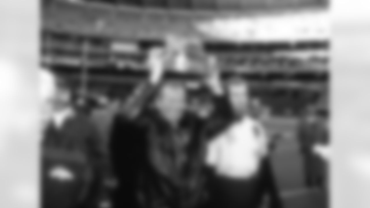 Owner Pat Bowlen carries the AFC Championship trophy after the Broncos' 24-21 win over the Steelers in the 1997 AFC Championship.