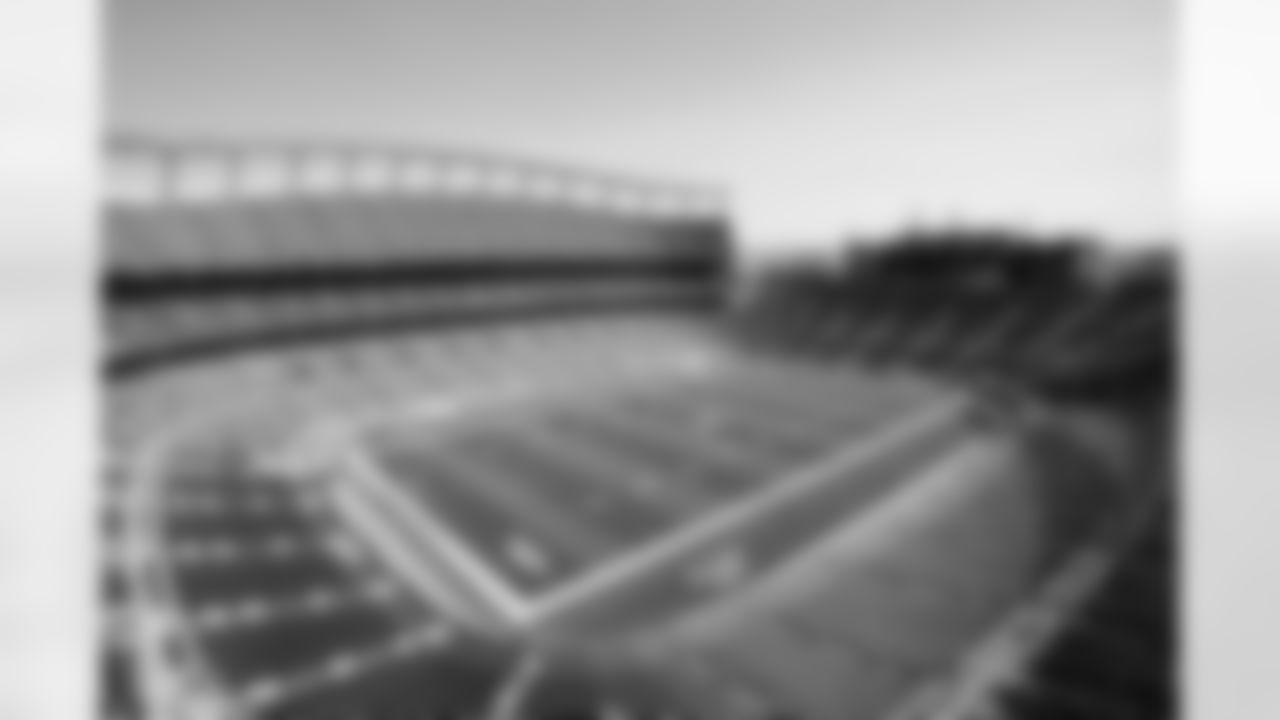 Members of the stadium's turf crew paint the field at Empower Field at Mile High on September 23, 2021 ahead of the team's Week 3 home opener. (Photo by Ben Swanson)
