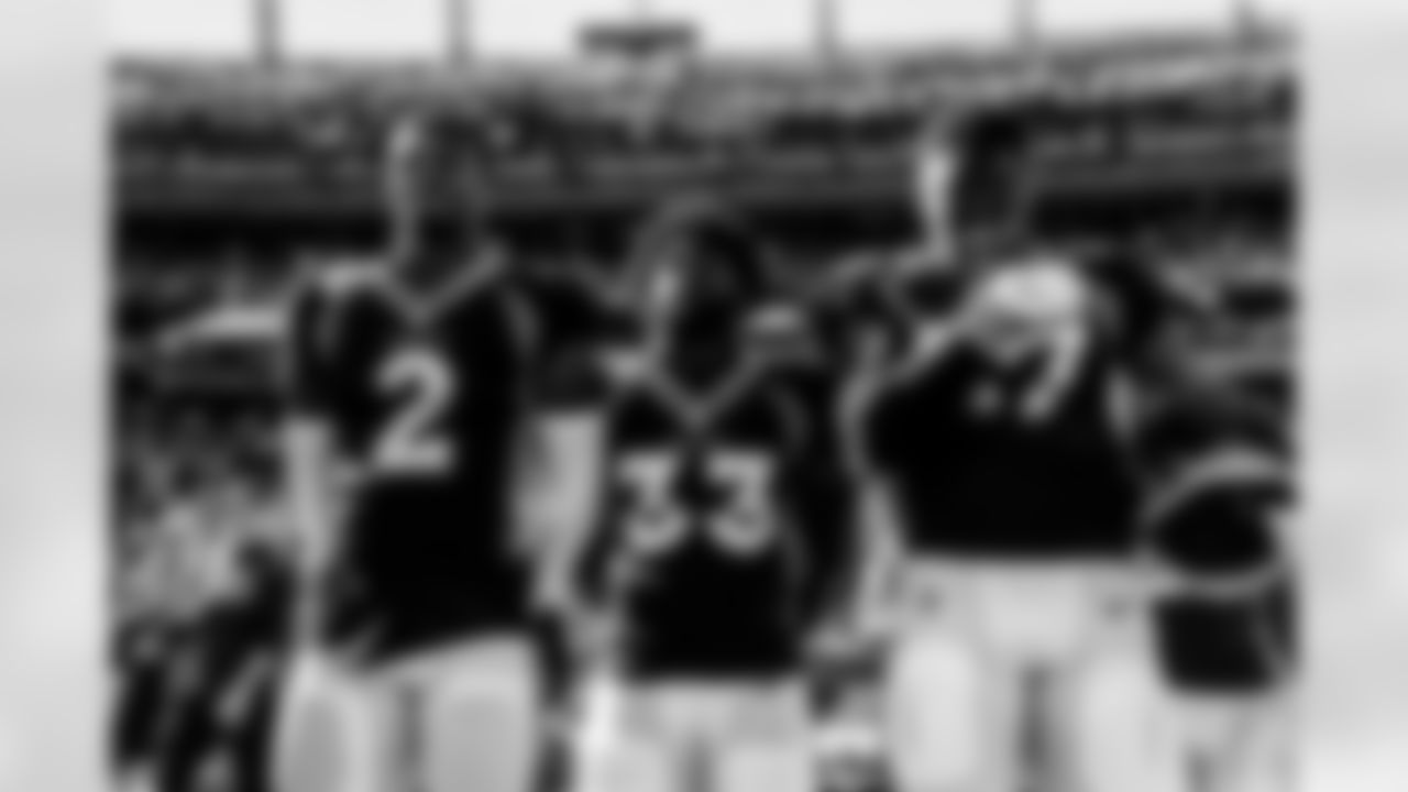 Pat Surtain II, Javonte Williams and Noah Fant during the national anthem before the Broncos' Week 6 game against the Las Vegas Raiders at Empower Field at Mile High in Denver, Colorado on October 17, 2021. (Photo by Sam Weaver)