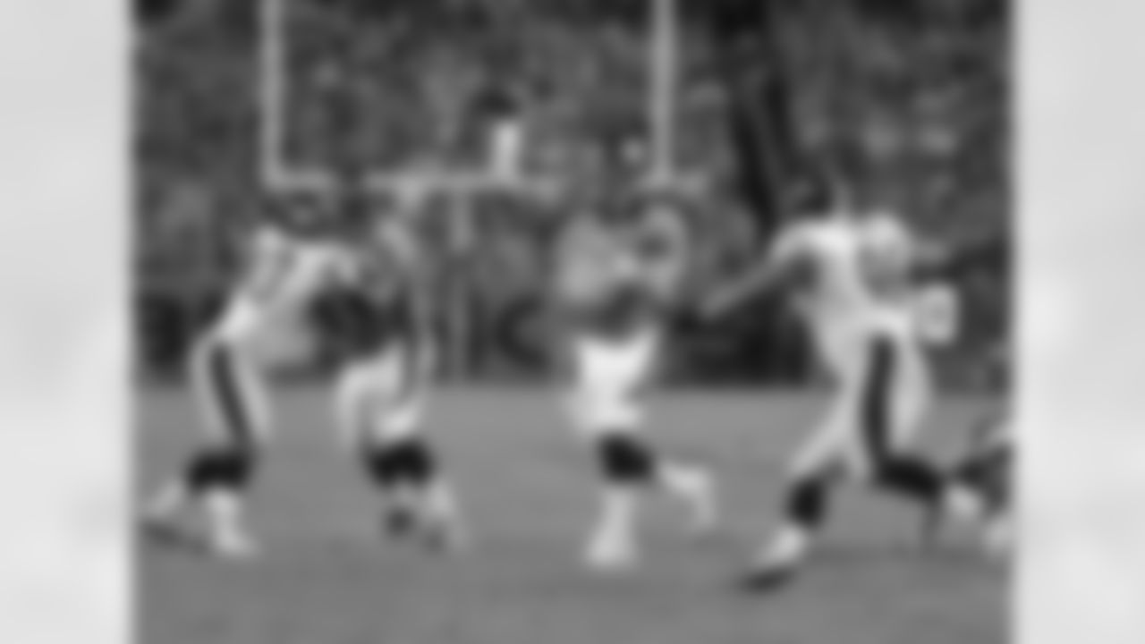 Manning throws a pass in the red zone.