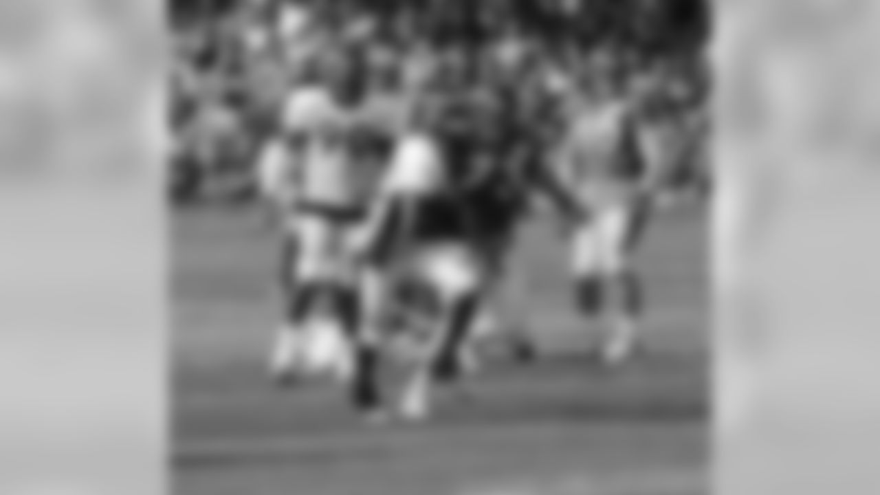 LB Wesley Woodyard picks up a fumbled snap and runs for the end zone.