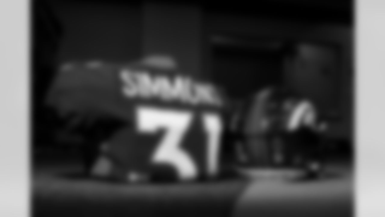 Justin Simmons's jersey and helmet with Inspire Change and Walter Payton NFL Man of the Year decals in the locker room before the Broncos' Week 18 game against the Kansas City Chiefs at Empower Field at Mile High in Denver, Colorado on January 8, 2022. (Photo by Ben Swanson)