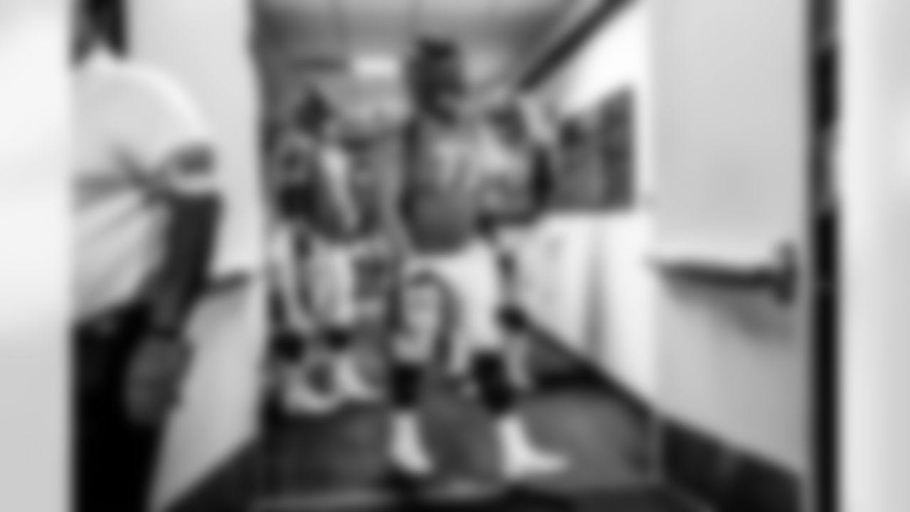 Garett Bolles walks out of the locker room during pregame warmups before the game against the Baltimore Ravens on October 3, 2021 at Empower Field at Mile High in Denver, Colorado. (Photo by Ben Swanson)