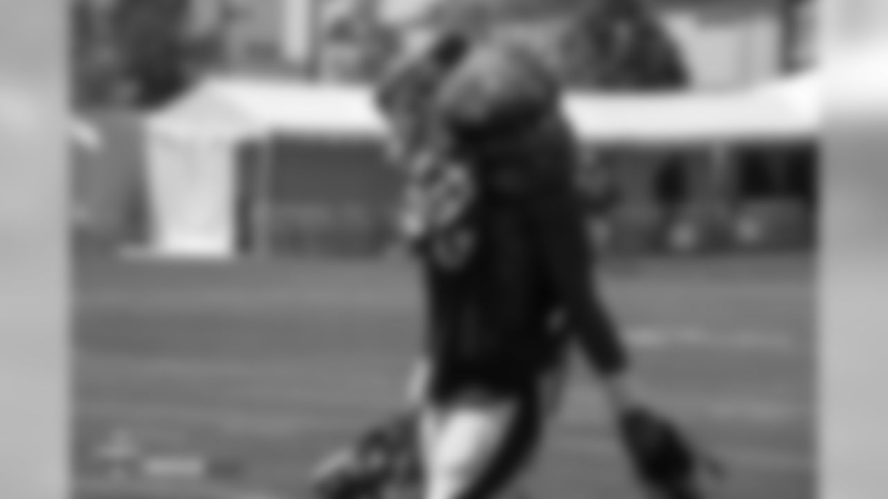 Wide receiver Courtland Sutton (14) carries extra pads on his shoulders, nearly covering his entire head, during the ninth day of training camp on August 7, 2018, at UCHealth Training Center.