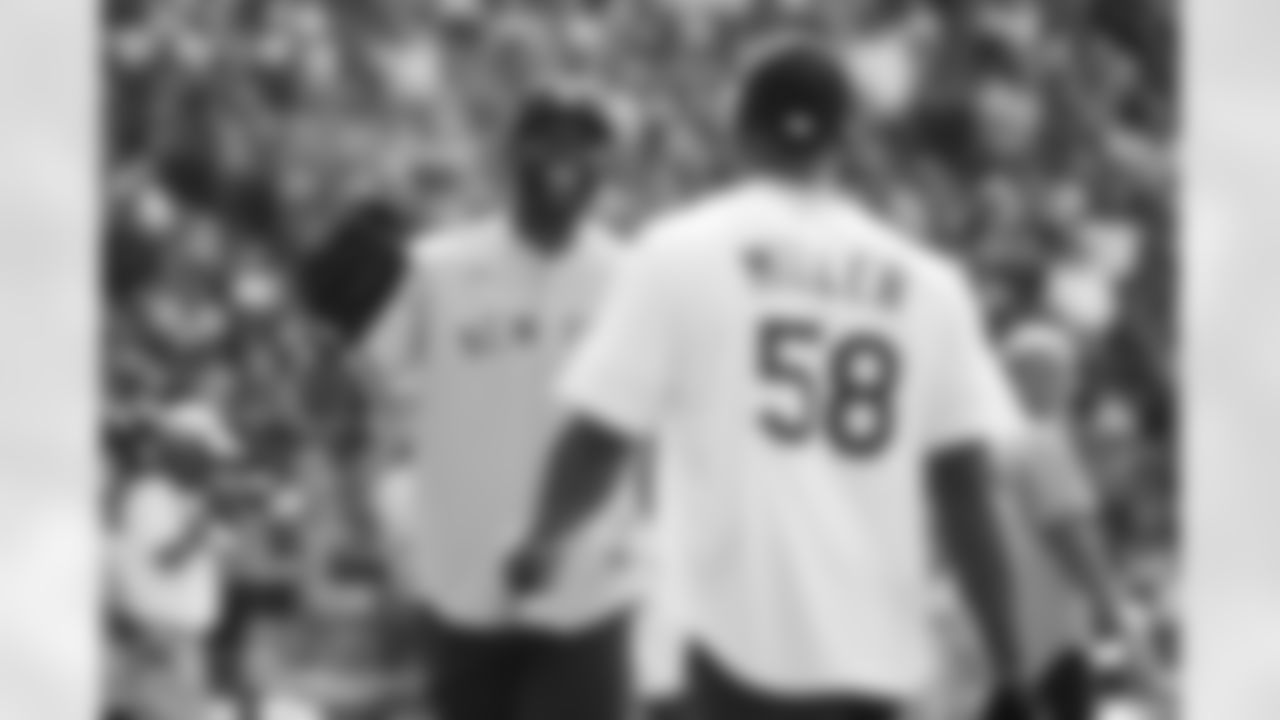 Von Miller talks with former MLB player CC Sabathia at the 2021 MLB All-Star Celebrity Softball Game at Coors Field on July 11, 2021. (Photo by Ben Swanson)