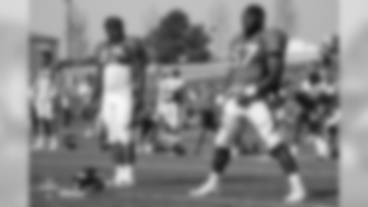 Running back De'Angelo Henderson Sr. (33) and running back Royce Freeman (37) at the fifth day of training camp on August 1, 2018, at UCHealth Training Center.
