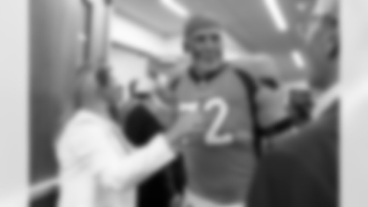 Denver Broncos offensive tackle Garett Bolles (72), Carrie Walton Penner and Greg Penner in the locker room after the NFL game against the Houston Texans on Sunday, September 18, 2022 at Empower Field at Mile High in Denver, Colorado.
Photo by Gabriel Christus/Denver Broncos