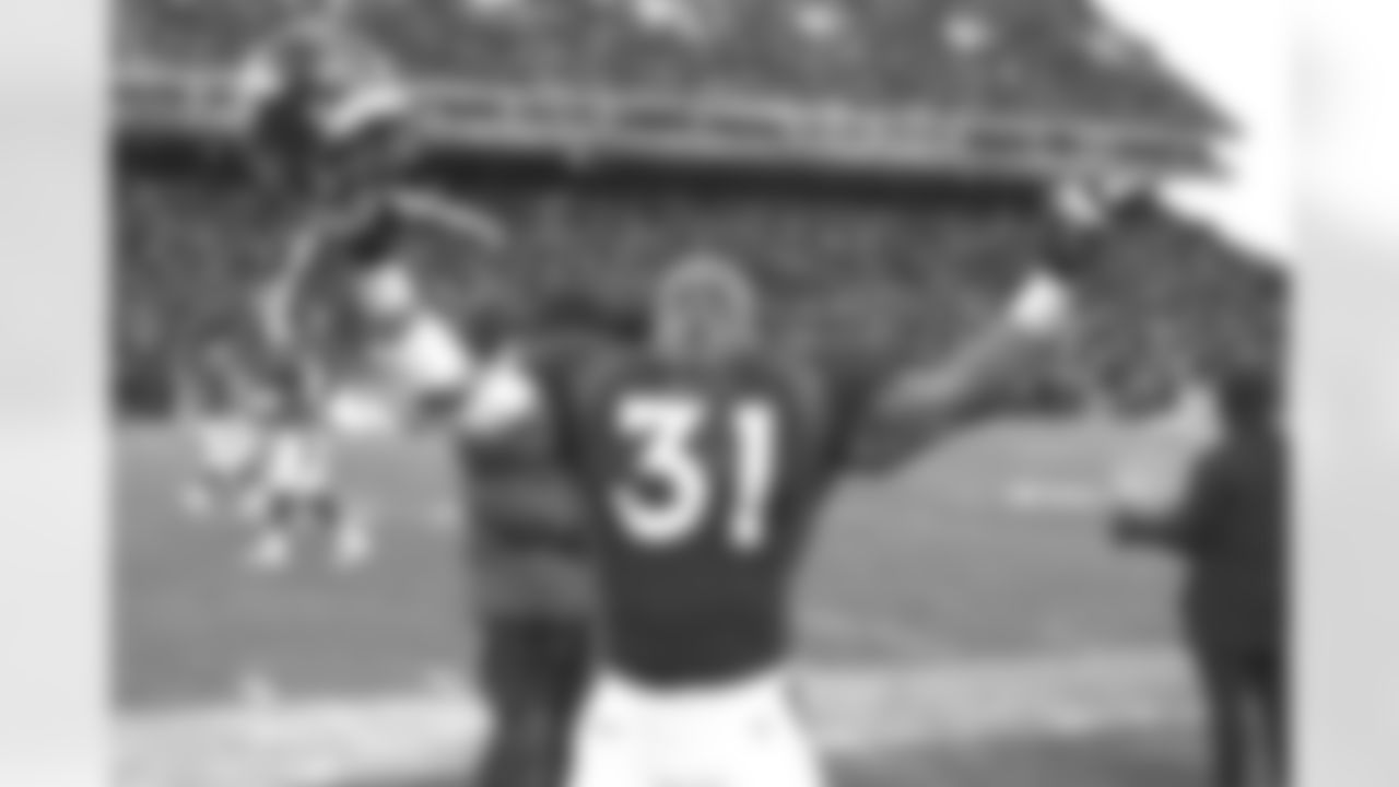 Denver: Derek Loville racked up 103 rushing yards and two touchdowns on just 11 carries and celebrated at the conclusion of the game against the Jacksonville Jaguars at Mile High Stadium in Denver, CO on December 27, 1997.