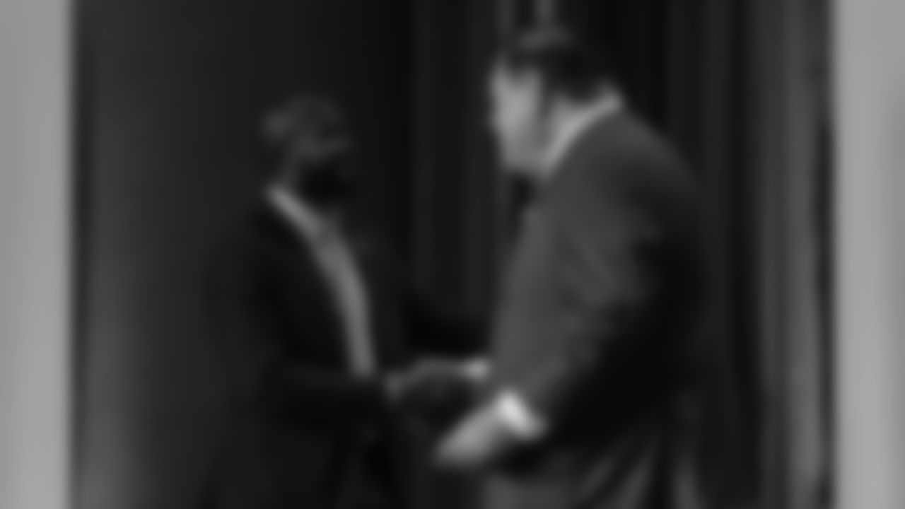 Champ Bailey greets David Baker at the press conference for the Pro Football Hall of Fame's Class of 2019 on February 2, 2019.