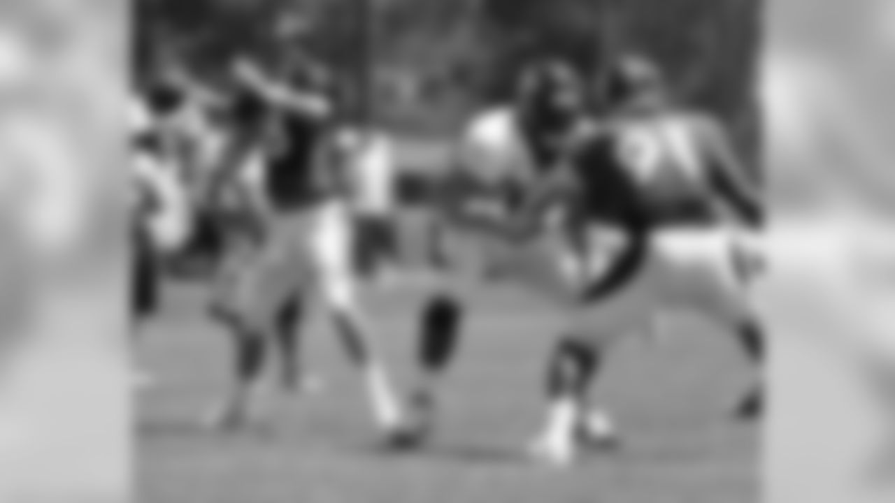 Manning fires a pass.