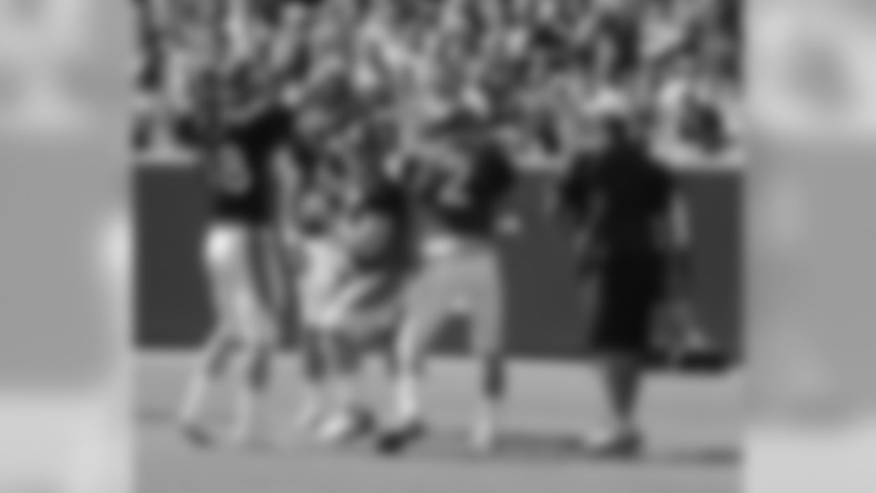 Manning simulated a rushing defensive lineman for the drill.
