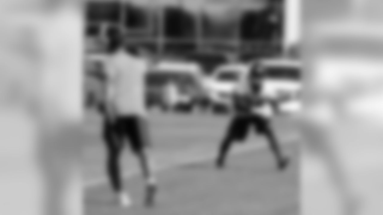 Woodson works with Moore in intercepting passes near the ground.