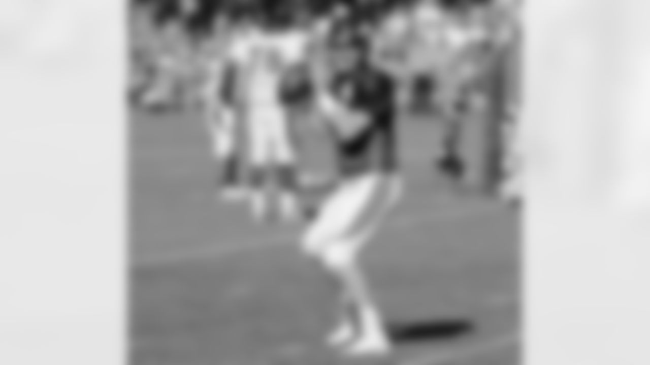 QB Peyton Manning loosens up before practice.