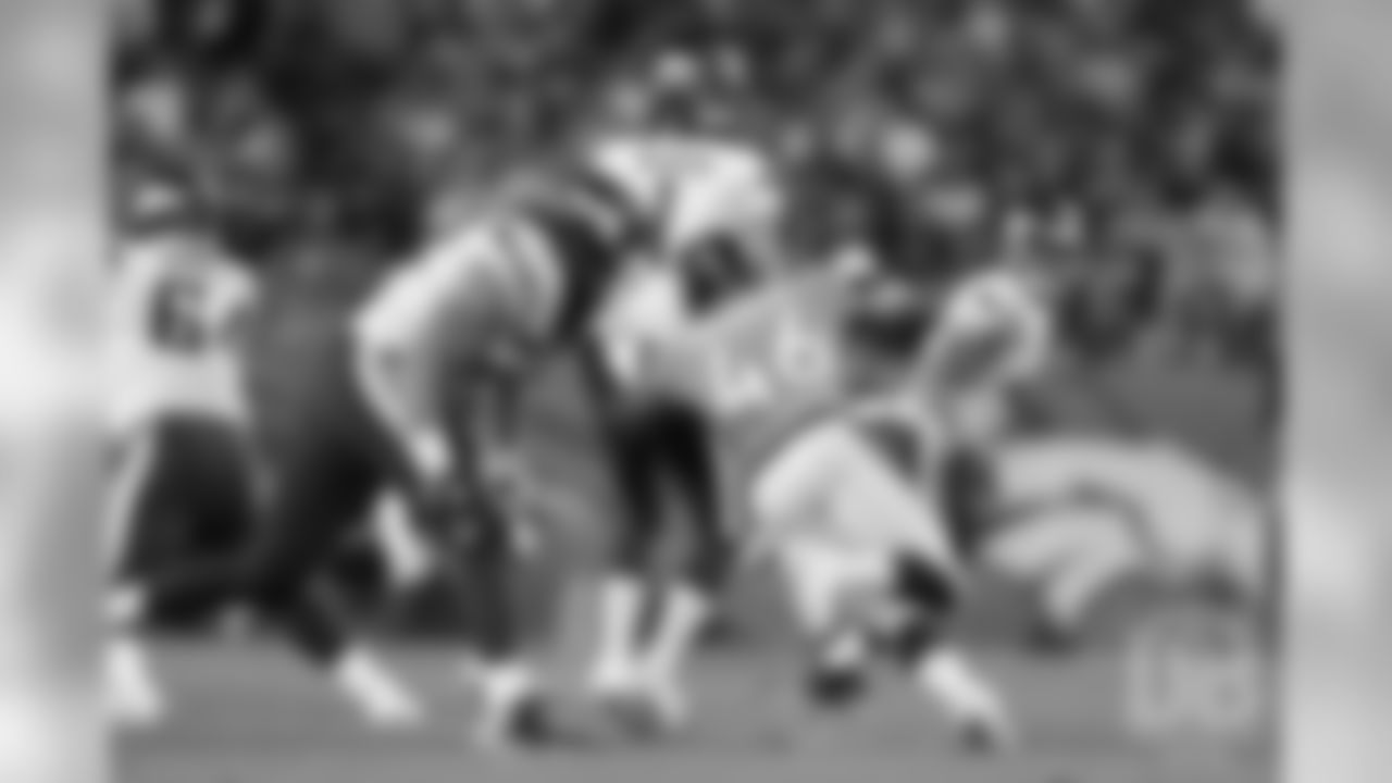 Outside linebacker Jeff Holland (46) closes in on a sack of Vikings QB Kyle Sloter.